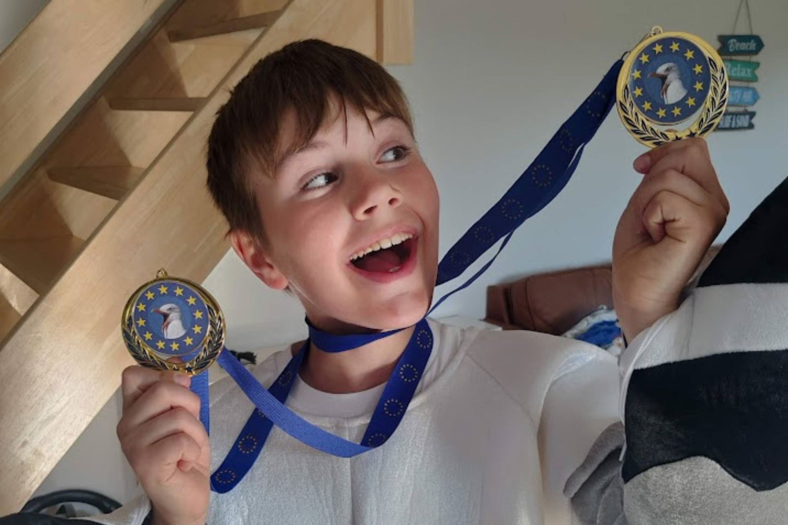 Junior seagull impersonator Cooper Wallace the two times European champion shows off his medals